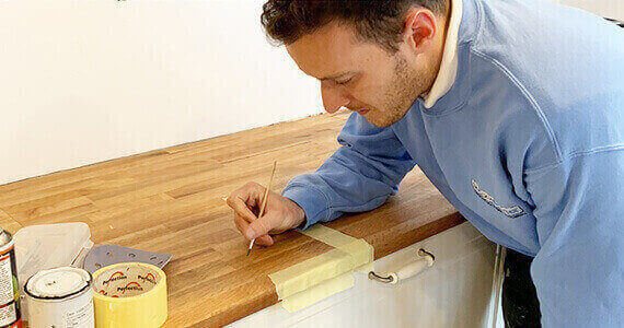 Bath Repair Edinburgh - Surface Doctor expert technician performing professional bathtub restoration using advanced repair techniques and precision tools in Edinburgh home bathroom
